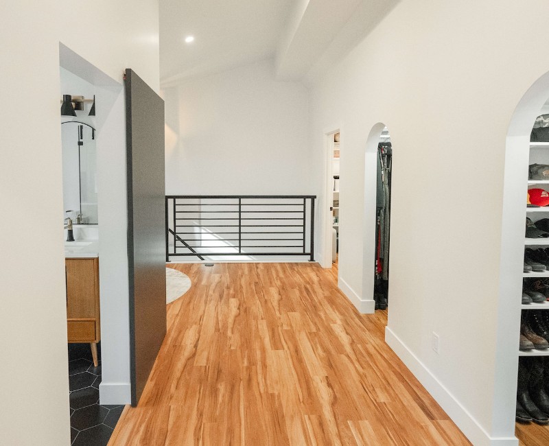 The owners of a 1950s ranch in Madison, WI wanted to transform their unfinished attic into a fully finished second floor with a primary bedroom retreat, ensuite bath, and plenty of closet space.
