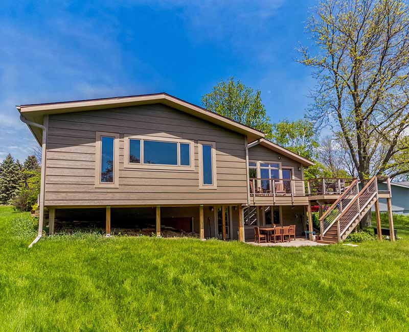 This home addition in Middleton, WI provided the homeowner with a quilting and craft room that has incredible views of the backyard and that opens out onto a fully remodeled deck.