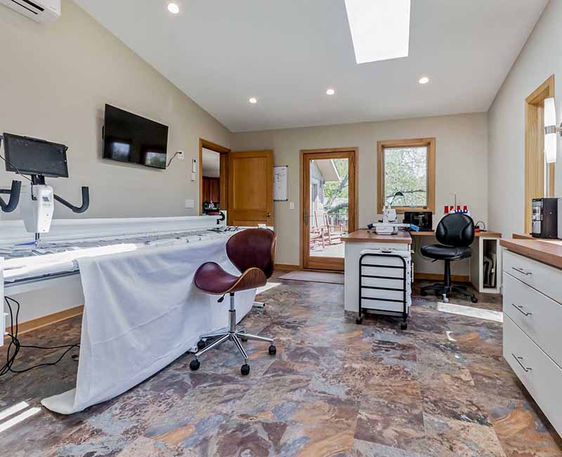 This home addition in Middleton, WI provided the homeowner with a quilting and craft room that has incredible views of the backyard and that opens out onto a fully remodeled deck.