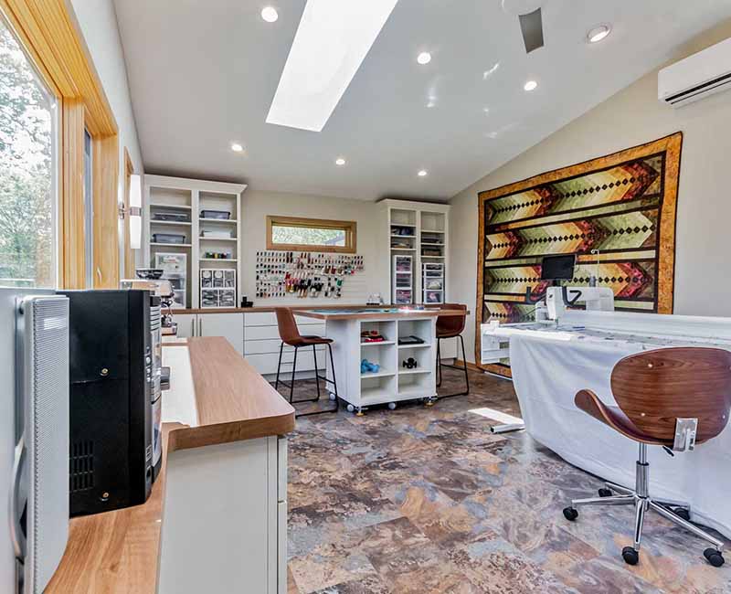 This home addition in Middleton, WI provided the homeowner with a quilting and craft room that has incredible views of the backyard and that opens out onto a fully remodeled deck.