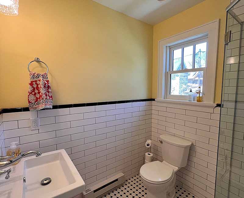 By removing a wall and creating a small addition we were able to give the homeowner a large bright kitchen as well as a full bathroom.