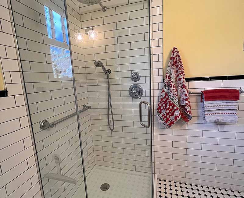 By removing a wall and creating a small addition we were able to give the homeowner a large bright kitchen as well as a full bathroom.