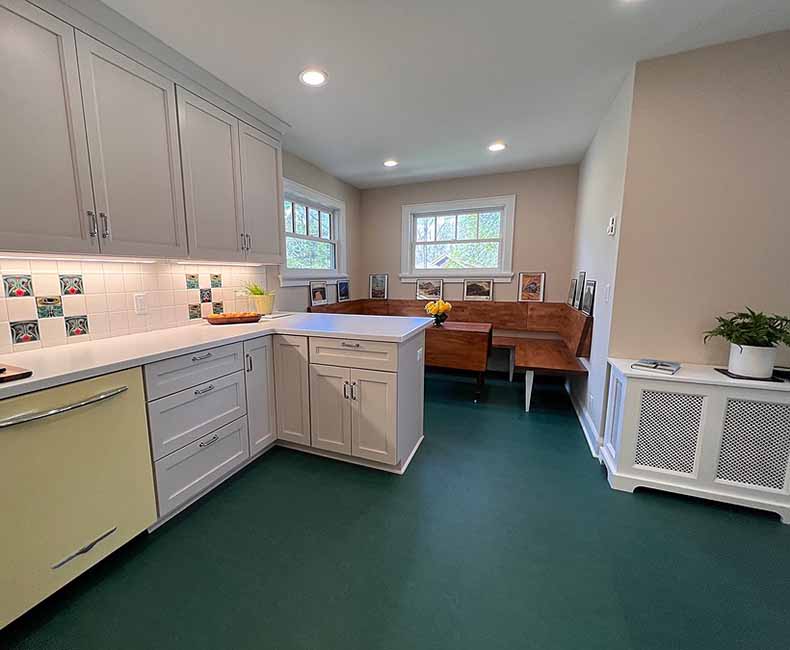 By removing a wall and creating a small addition we were able to give the homeowner a large bright kitchen as well as a full bathroom.