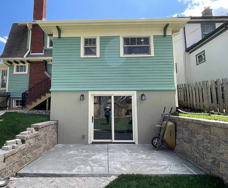 By removing a wall and creating a small addition we were able to give the homeowner a large bright kitchen as well as a full bathroom.