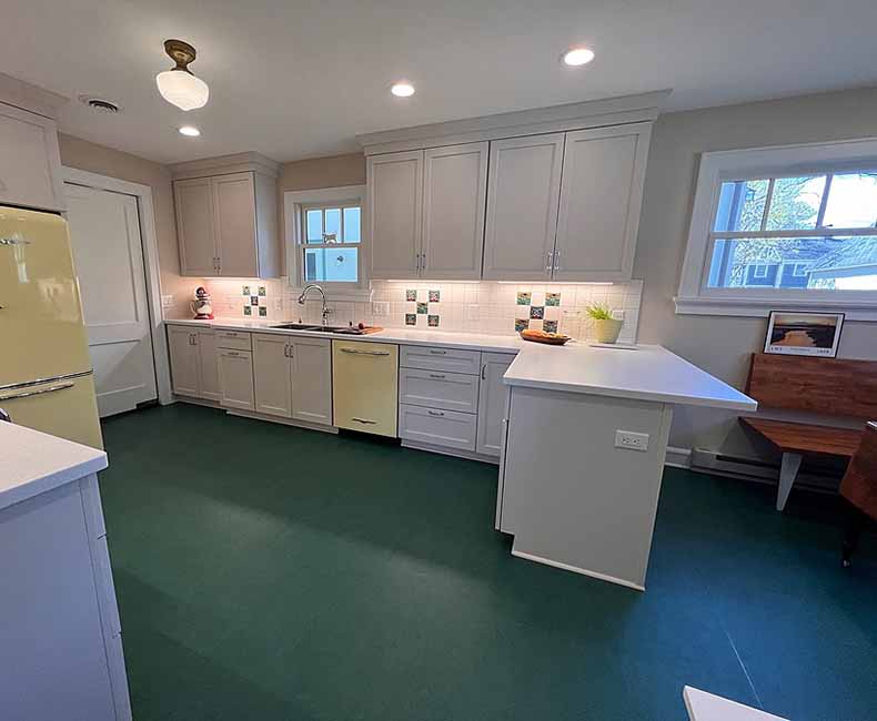 By removing a wall and creating a small addition we were able to give the homeowner a large bright kitchen as well as a full bathroom.