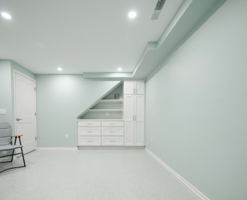 A basement remodel in Madison, WI that transformed an unfinished basement into a rec room, complete with a private full bath. The layout gives the kids a place that’s entirely their own: room to run around, play with toys, and sleep. 
