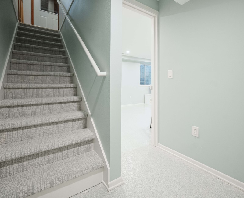 A basement remodel in Madison, WI that transformed an unfinished basement into a rec room, complete with a private full bath. The layout gives the kids a place that’s entirely their own: room to run around, play with toys, and sleep. 