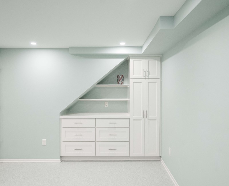 A basement remodel in Madison, WI that transformed an unfinished basement into a rec room, complete with a private full bath. The layout gives the kids a place that’s entirely their own: room to run around, play with toys, and sleep. 