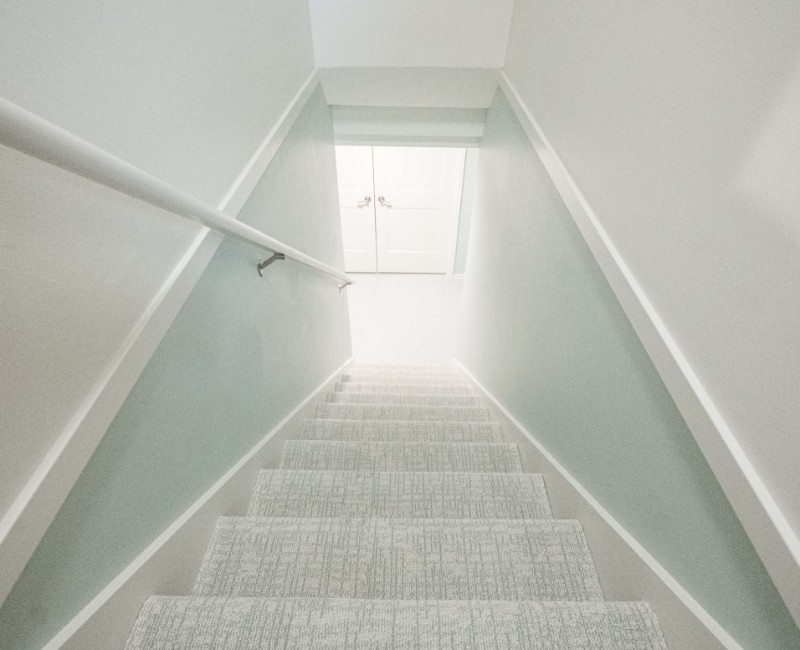 A basement remodel in Madison, WI that transformed an unfinished basement into a rec room, complete with a private full bath. The layout gives the kids a place that’s entirely their own: room to run around, play with toys, and sleep. 