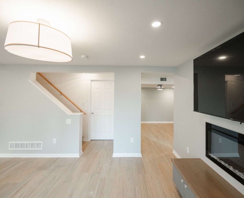 This basement remodel was part of a full basement and kitchen renovation in Madison, WI. Our design-build team transformed an outdated basement into a spacious rec room with wet bar and fridge, a den or office area, and a full bathroom. 