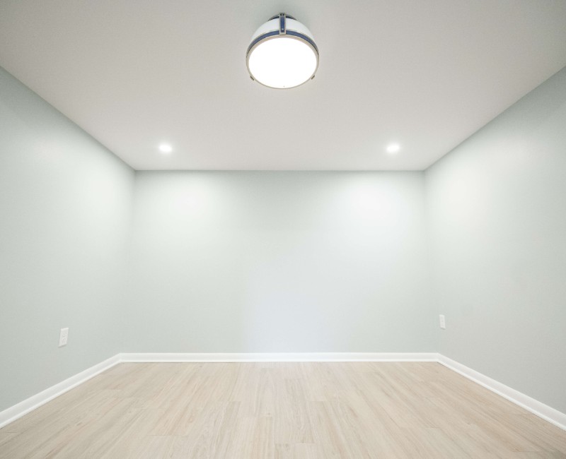 This basement remodel was part of a full basement and kitchen renovation in Madison, WI. Our design-build team transformed an outdated basement into a spacious rec room with wet bar and fridge, a den or office area, and a full bathroom. 