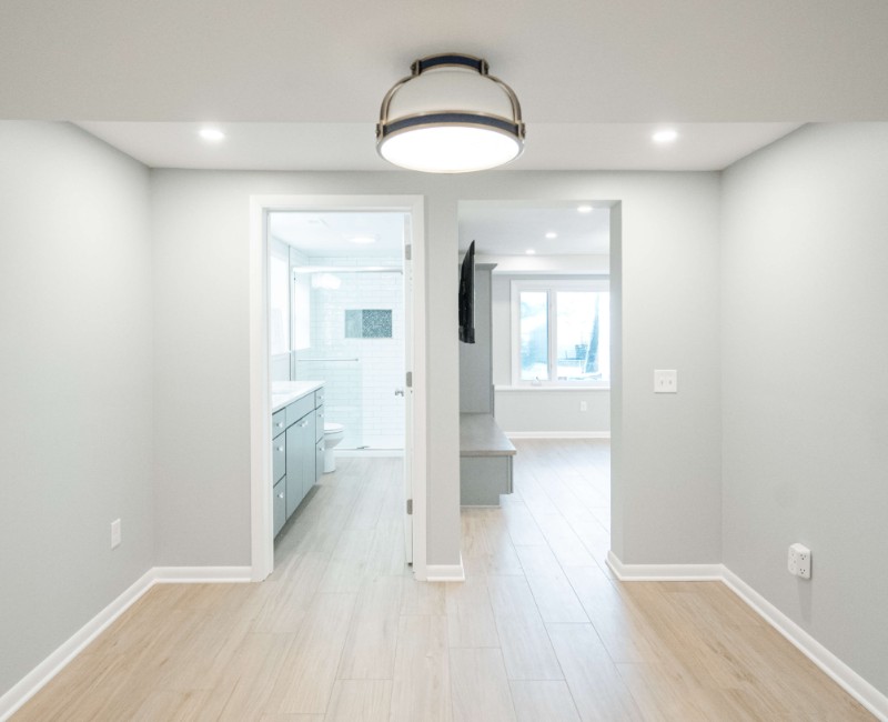 This basement remodel was part of a full basement and kitchen renovation in Madison, WI. Our design-build team transformed an outdated basement into a spacious rec room with wet bar and fridge, a den or office area, and a full bathroom. 
