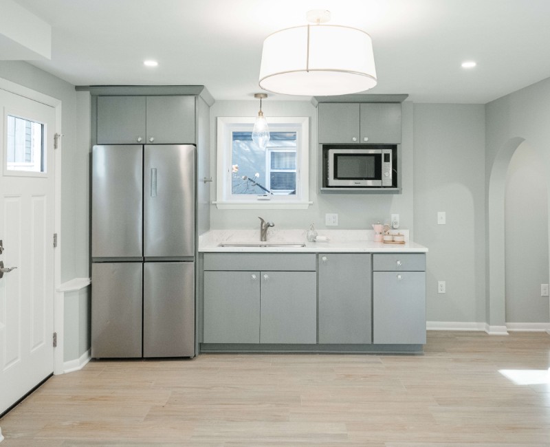 This basement remodel was part of a full basement and kitchen renovation in Madison, WI. Our design-build team transformed an outdated basement into a spacious rec room with wet bar and fridge, a den or office area, and a full bathroom. 