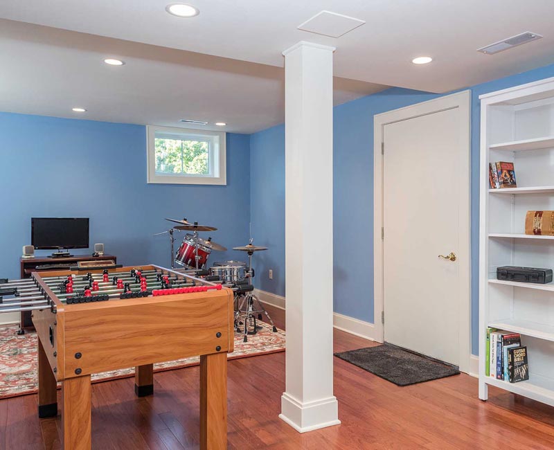 We transformed a formerly damp and dark basement in Madison, WI, into a fun and functional recreation space that is comfortable and bright.
