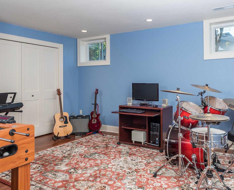 We transformed a formerly damp and dark basement in Madison, WI, into a fun and functional recreation space that is comfortable and bright.