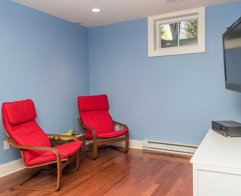 We transformed a formerly damp and dark basement in Madison, WI, into a fun and functional recreation space that is comfortable and bright.