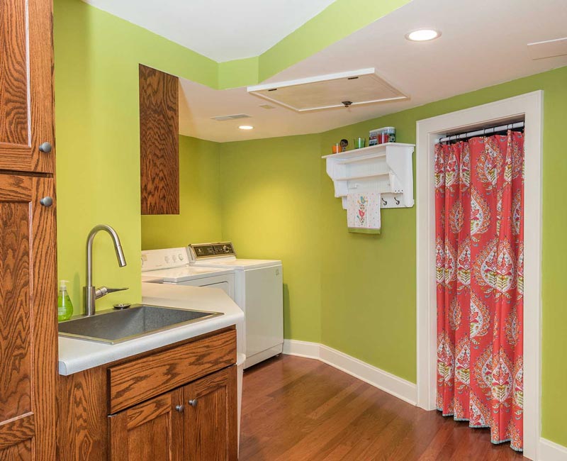 We transformed a formerly damp and dark basement in Madison, WI, into a fun and functional recreation space that is comfortable and bright.