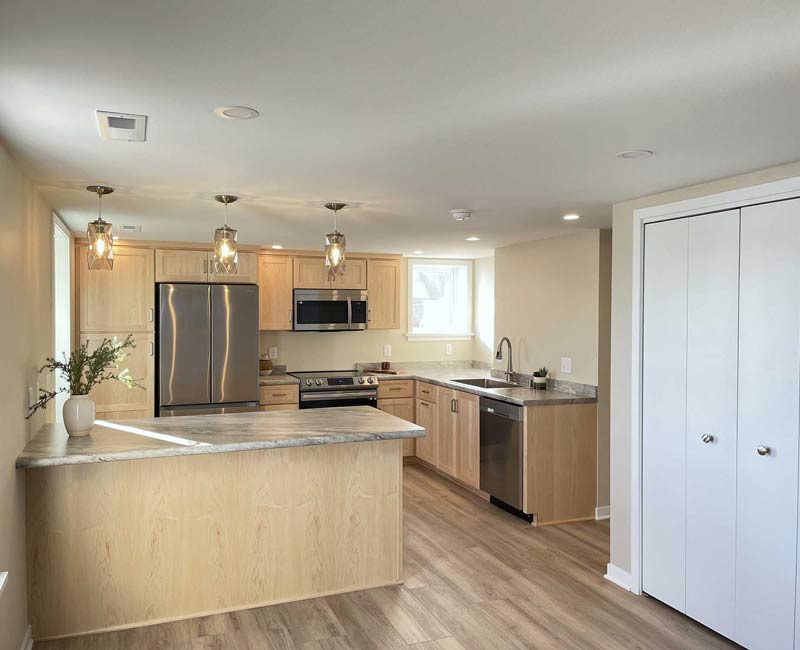 We remodeled this basement in Madison, WI, into a spacious, yet efficient, apartment that is full of natural light and lots of storage.