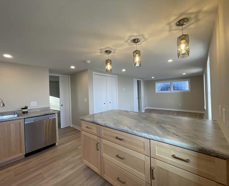 We remodeled this basement in Madison, WI, into a spacious, yet efficient, apartment that is full of natural light and lots of storage.