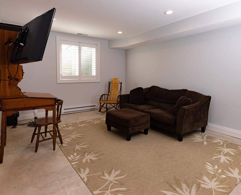 As part of our complete remodel of this Tudor Revival home in Madison, a step-down basement was added under the family room addition.