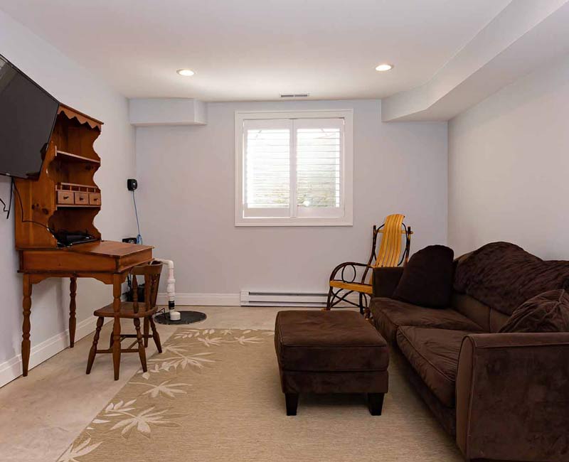 As part of our complete remodel of this Tudor Revival home in Madison, a step-down basement was added under the family room addition.