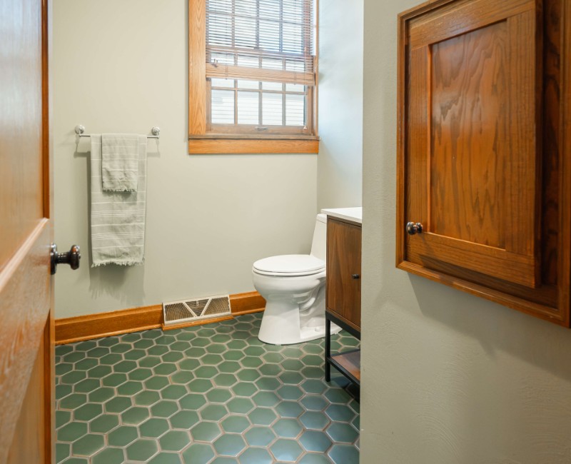 These two bathroom remodels are part of a larger whole-home renovation in Madison's Nakoma neighborhood, using unique tile in both spaces that brought our client's creative vision to life.