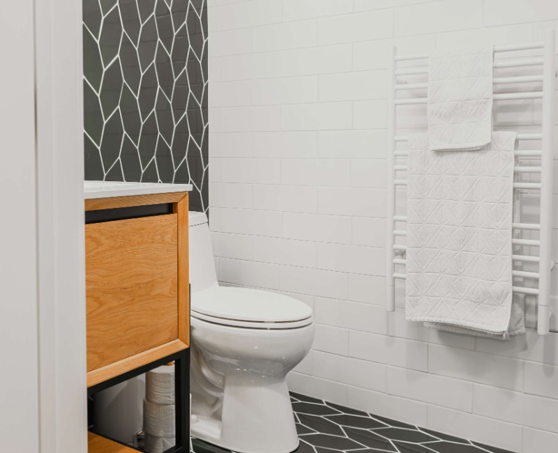 These two bathroom remodels are part of a larger whole-home renovation in Madison's Nakoma neighborhood, using unique tile in both spaces that brought our client's creative vision to life.