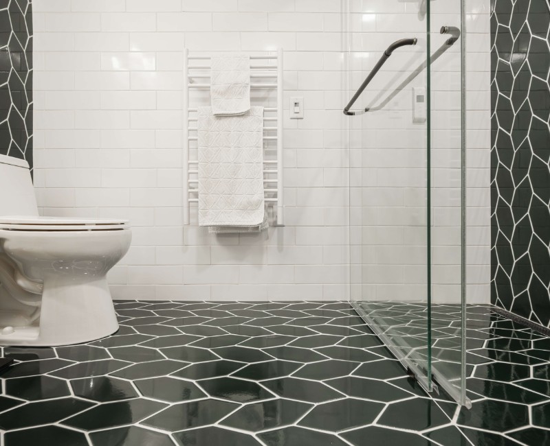 These two bathroom remodels are part of a larger whole-home renovation in Madison's Nakoma neighborhood, using unique tile in both spaces that brought our client's creative vision to life.