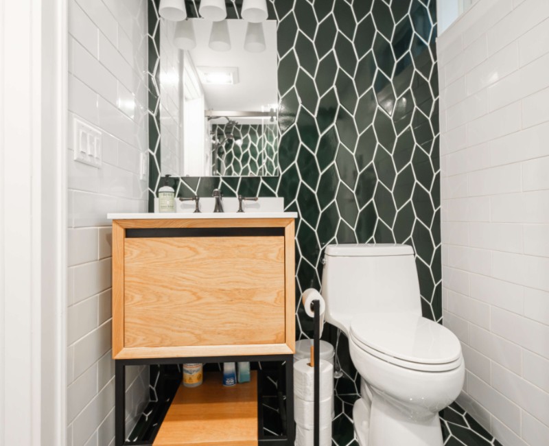 These two bathroom remodels are part of a larger whole-home renovation in Madison's Nakoma neighborhood, using unique tile in both spaces that brought our client's creative vision to life.