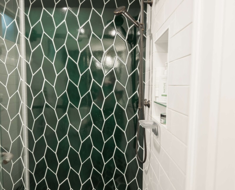 These two bathroom remodels are part of a larger whole-home renovation in Madison's Nakoma neighborhood, using unique tile in both spaces that brought our client's creative vision to life.
