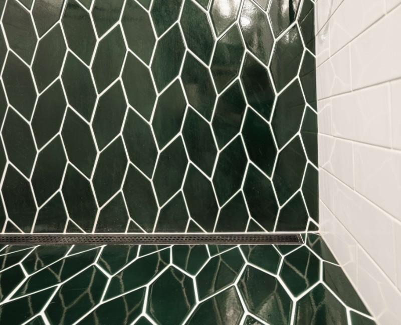 These two bathroom remodels are part of a larger whole-home renovation in Madison's Nakoma neighborhood, using unique tile in both spaces that brought our client's creative vision to life.