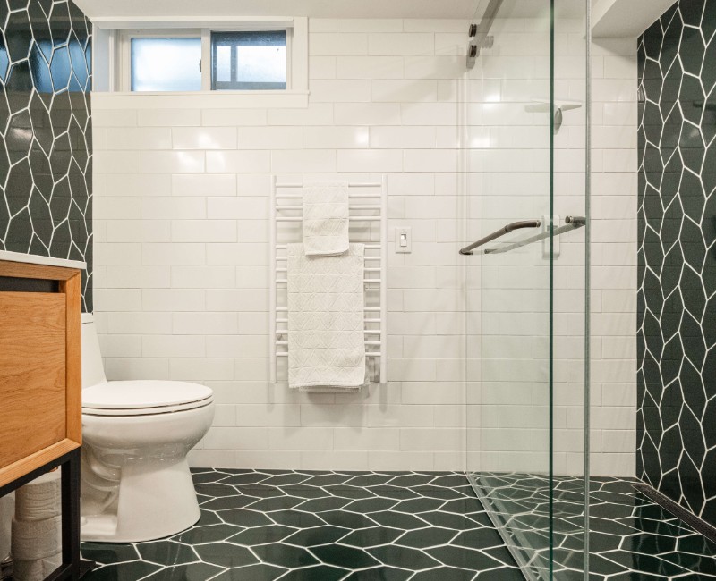 These two bathroom remodels are part of a larger whole-home renovation in Madison's Nakoma neighborhood, using unique tile in both spaces that brought our client's creative vision to life.