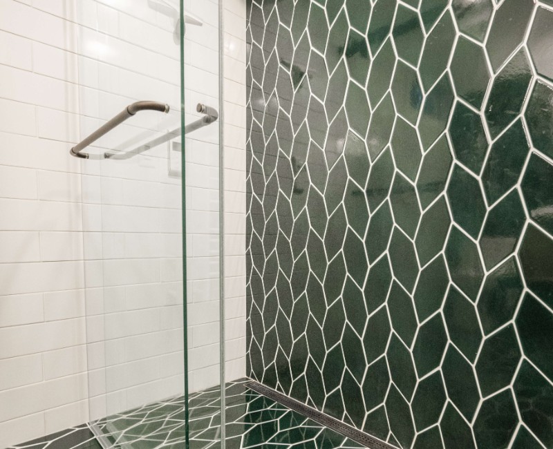 These two bathroom remodels are part of a larger whole-home renovation in Madison's Nakoma neighborhood, using unique tile in both spaces that brought our client's creative vision to life.