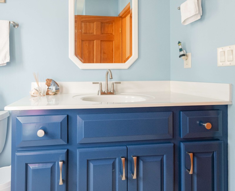 This bathroom renovation in a home on Madison's west side was part of a complete kitchen and bath remodel. In the primary bathroom, we removed the original tub and replaced it with a custom walk-in shower. The shower is hassle-free and easy to clean with no door or curtain. 