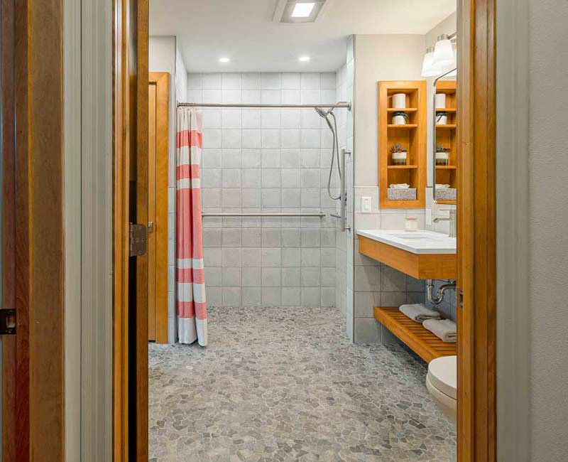 This award-winning bathroom remodel in Madison, WI was designed to meet the accessibility needs of the homeowner’s daughter and to allow the homeowners to age in place through universal design.