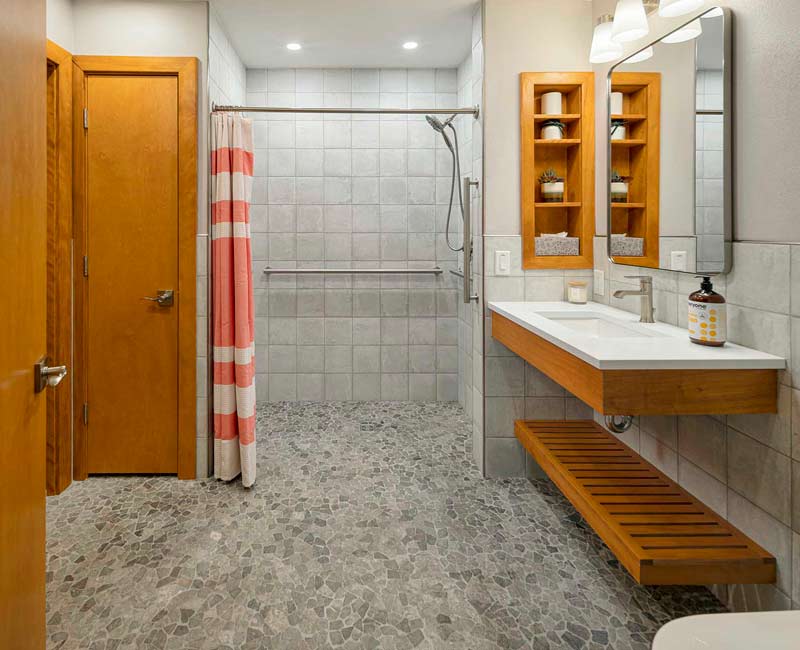 This award-winning bathroom remodel in Madison, WI was designed to meet the accessibility needs of the homeowner’s daughter and to allow the homeowners to age in place through universal design.