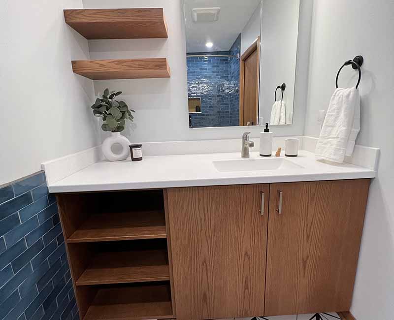 We kept the mid-century modern vibe alive in this two-bathroom remodel in Madison, WI.