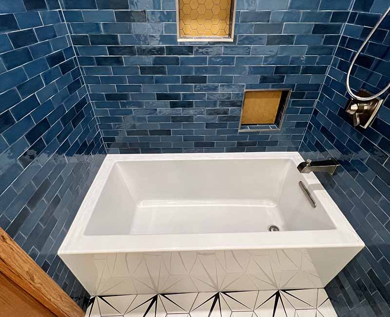 We kept the mid-century modern vibe alive in this two-bathroom remodel in Madison, WI.