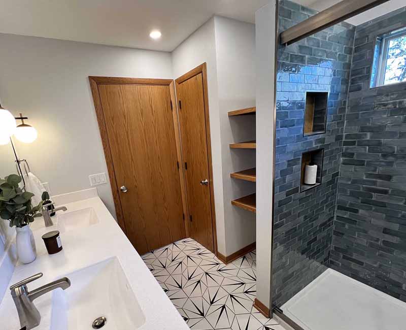 We kept the mid-century modern vibe alive in this two-bathroom remodel in Madison, WI.