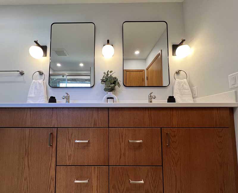We kept the mid-century modern vibe alive in this two-bathroom remodel in Madison, WI.