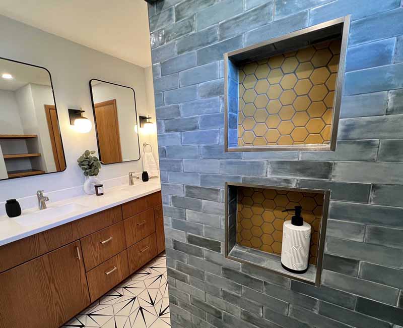 We kept the mid-century modern vibe alive in this two-bathroom remodel in Madison, WI.