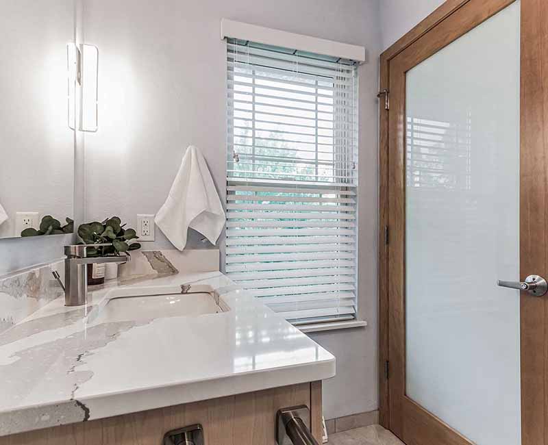 We completed a full remodel of both the primary bathroom and guest bathroom in this home in Madison, WI. Cambria quartz was used on all shower and bath walls and the tops of the bathroom vanities.