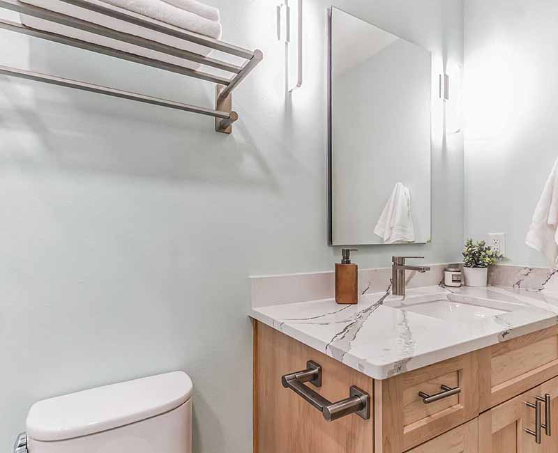 We completed a full remodel of both the primary bathroom and guest bathroom in this home in Madison, WI. Cambria quartz was used on all shower and bath walls and the tops of the bathroom vanities.