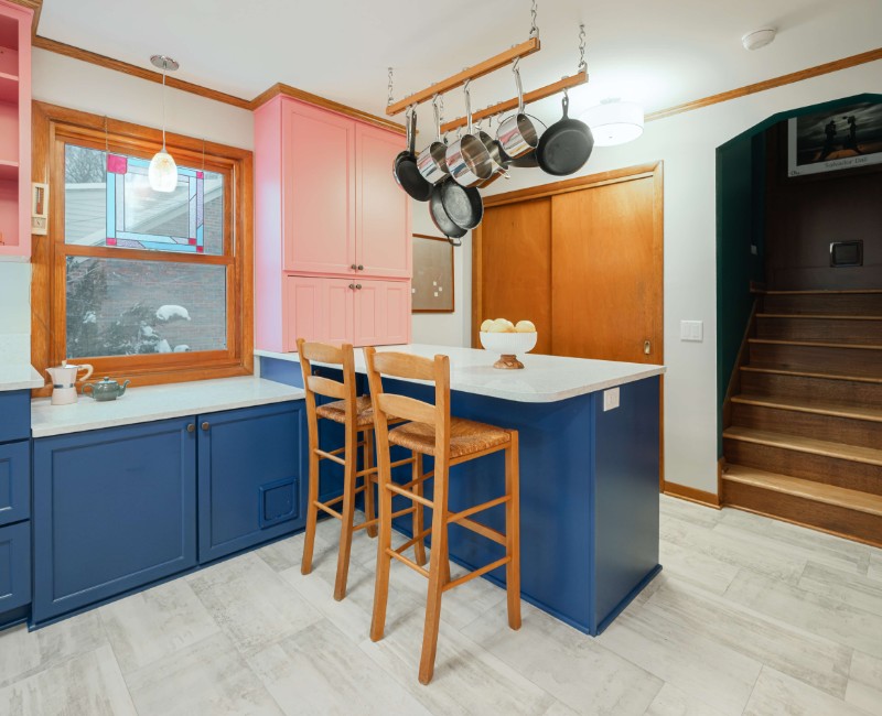 A kitchen gut and remodel in Madison that features a bold color palette and tons of storage. 