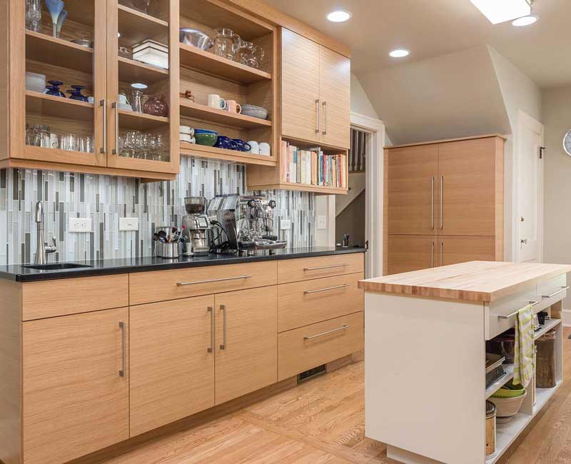 We created this bright and expansive kitchen and dining area by removing a wall and allowing light to pour into the space.