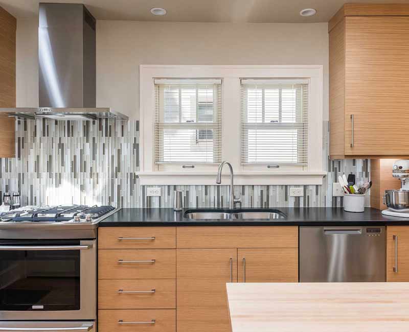 We created this bright and expansive kitchen and dining area by removing a wall and allowing light to pour into the space.