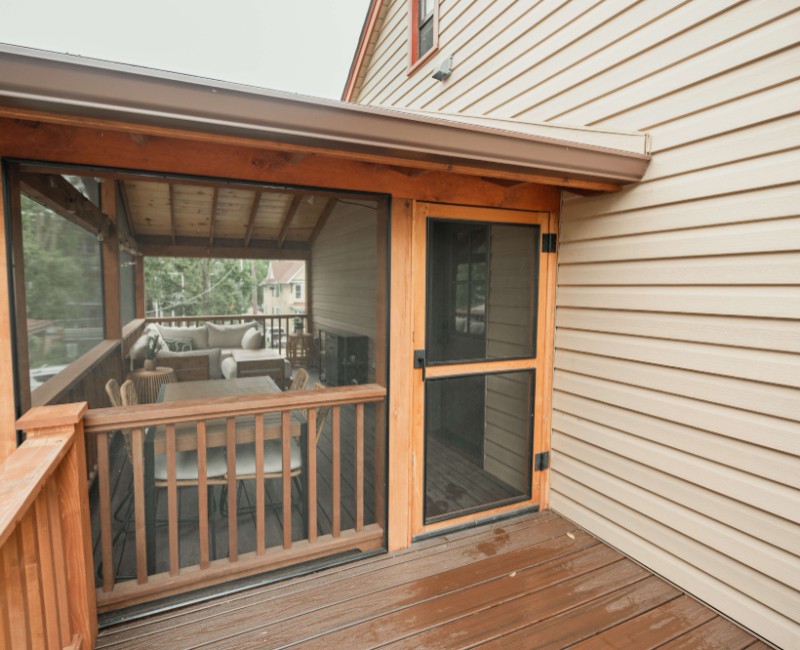 A screened-in porch addition for a historic Madison, WI home. We built a durable screened-in porch for shaded outdoor living; an open, sunny side deck; and a spiral staircase for backyard access. 
