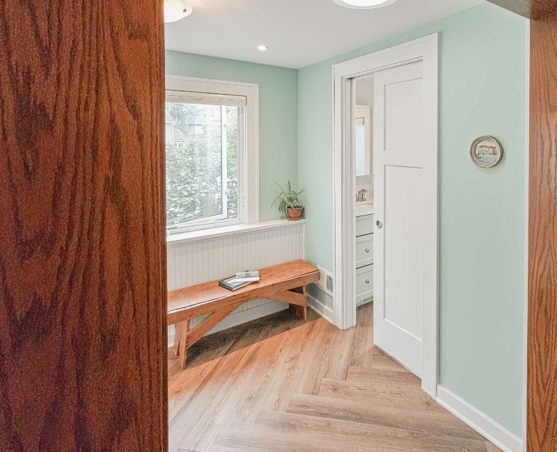 What began as a cold, drafty enclosed porch is now one of the homeowners’ favorite rooms. A bright, energy-efficient sunroom with a beautifully integrated first-floor bathroom. 