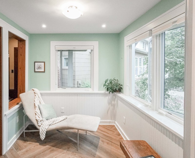 What began as a cold, drafty enclosed porch is now one of the homeowners’ favorite rooms. A bright, energy-efficient sunroom with a beautifully integrated first-floor bathroom. 