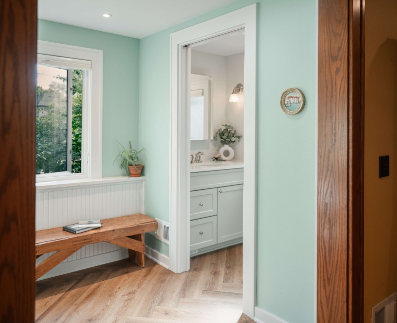What began as a cold, drafty enclosed porch is now one of the homeowners’ favorite rooms. A bright, energy-efficient sunroom with a beautifully integrated first-floor bathroom. 
